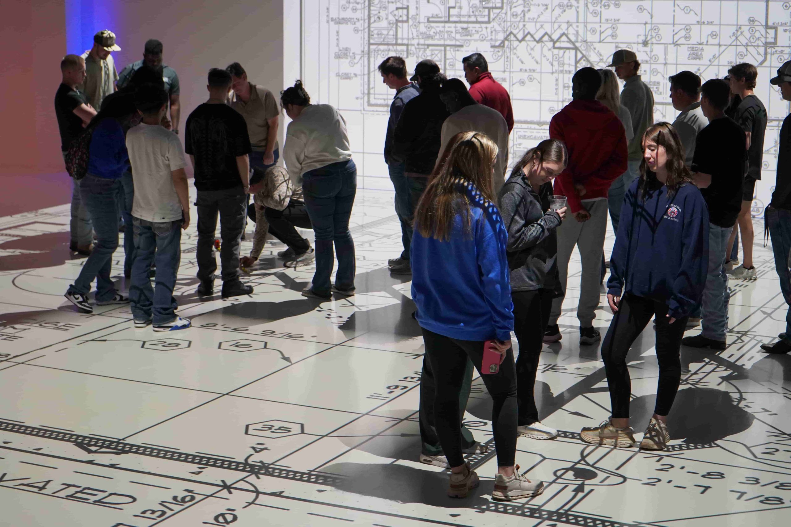 Foundation Photo(1) Students exploring a full-scale floor plan during a community visit to Walk Your Plans Nashville