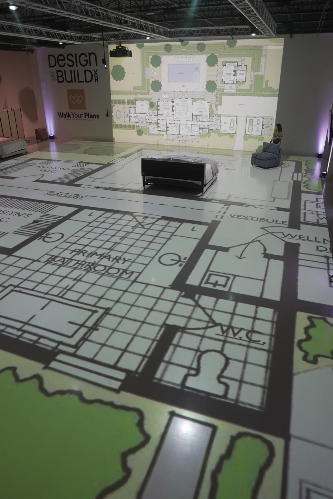 Life size floor plan and site plan projected across the Walk Your Plans Nashville studio