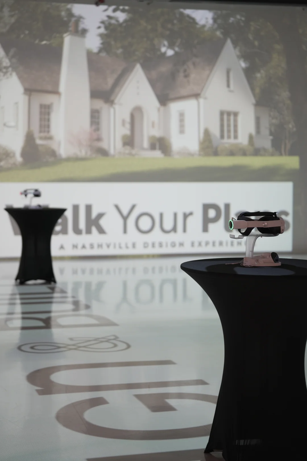 VR headsets set up in front of a projected home exterior at Walk Your Plans